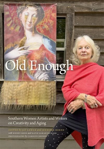 The cover of Old Enough is a women standing beside a painting of a woman