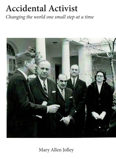 Cover of Accidental Activist. Black and white photo of the author with four other people. 